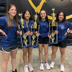 Girls with the three trophies the team earned