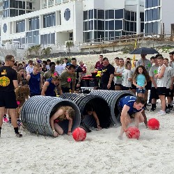 Collin Baggett passes through obstacle course tube