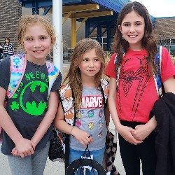 Students in superhero shirts