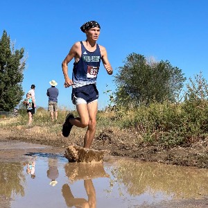 Boy's foot splashes in mud on race course