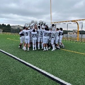 JV Football players celebrate