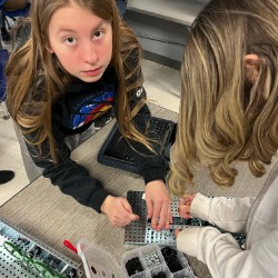Students building in robotics 