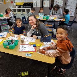 Students coloring with the principals