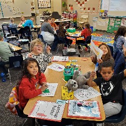 Students coloring with the principals