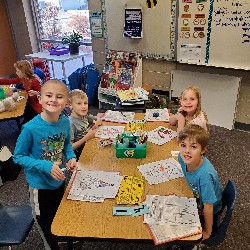 Students coloring with the principals