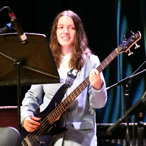 Student playing electric guitar