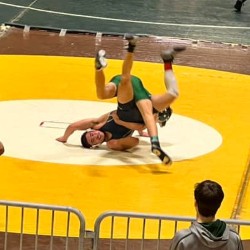 Two wrestlers engaged in competition