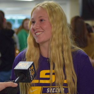 Student talking to a news reporter.