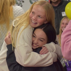 Two girls hugging