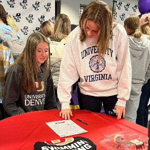 Two girls looking at letter