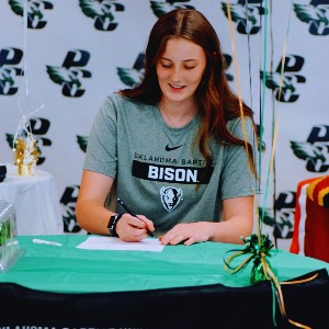 Girl signing paper