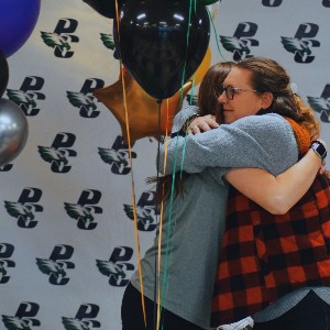 Coach hugging volleyball player