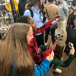 Crowd taking pictures of the ceremony