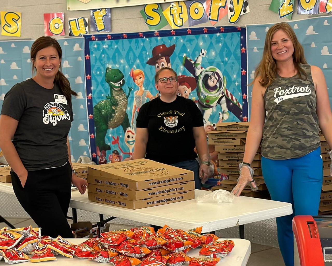 volunteers hosting a pizza party