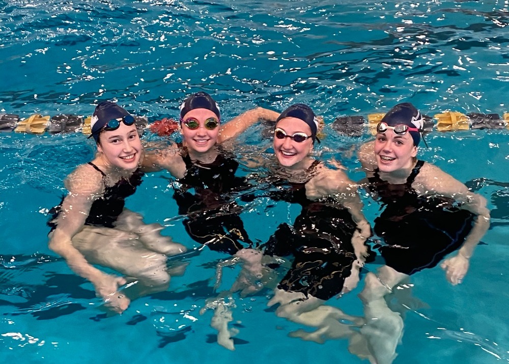 girls swimming in water