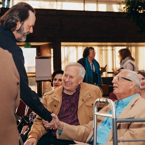 Bob Cohn shaking hands with Michael Arsenault, HR Director