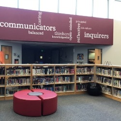 A view of the Antelope Trails library showing a seating area and several rows of books.