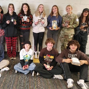 Interior Design students in Blue 2 pose with their 3D projects.