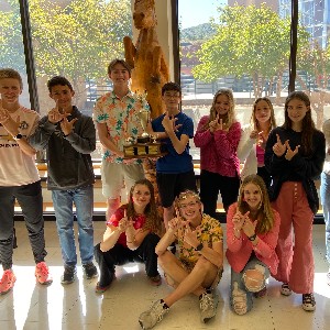 Liberty students from Knowledge Bowl hold up the double L's for Liberty Lancers at Manitou High School.
