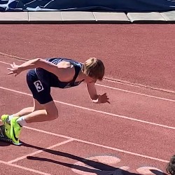 Athlete in neon yellow shoes starts his race