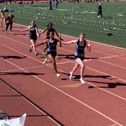 Baton handoff during the Girls relay race