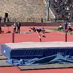 Athlete throwing her back over the high jump