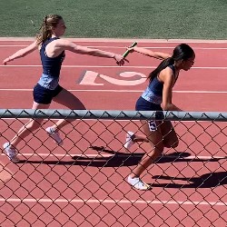 Baton handoff during the Girls relay