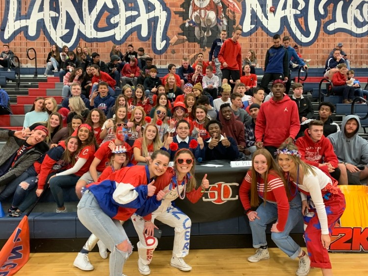 Students gathered at an assembly wearing their spirit gear.