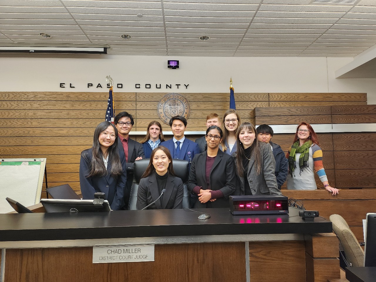 Students standing in front of the judge's bench at the El Paso County Courthouse