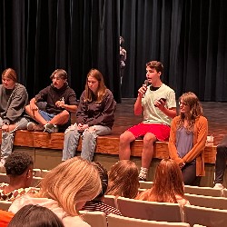 Student directors lead a meeting prior to dress rehearsal.