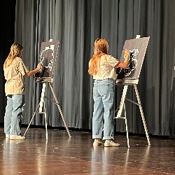 Talented artists paint scenes to a catchy tune.