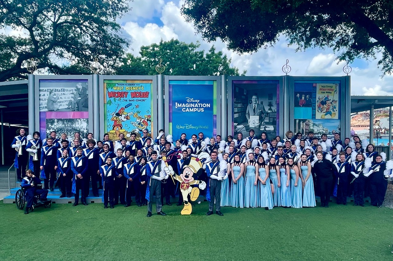 Band and Color Guard pose with Mickey Mouse 