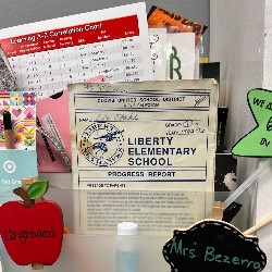 Mrs. Bezerra keeps her first-grade report card on display in her classroom