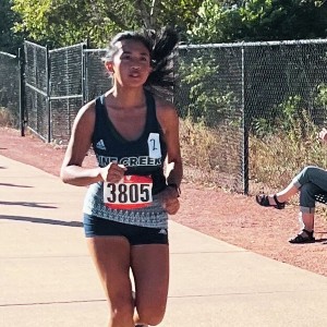 Girl running at Rampart Invitational