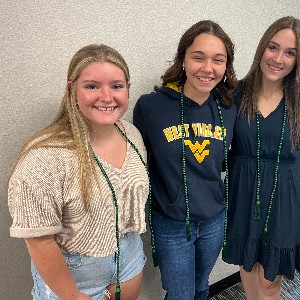 Three girls, smiling