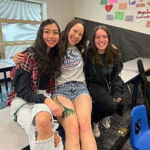 Girls, smiling for the camera at Seal of Biliteracy ceremony