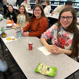 Girls eating at table