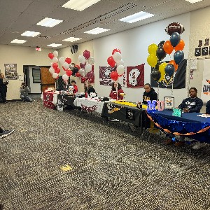 Football players preparing to sign their letters of intent