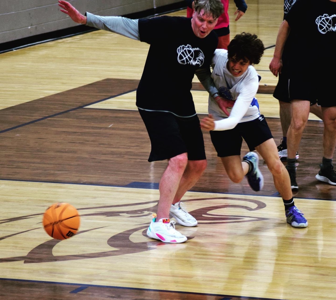 Student chasing the basketball