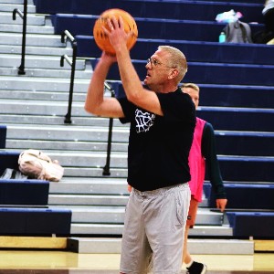 Man member shooting basketball