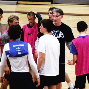 Mr. Rausch, shaking hands with Seniors after the completion of the game.