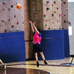 Student shooting basket