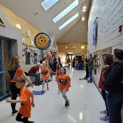 Students running at the Apex fun run