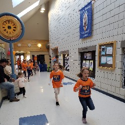 Students running at the Apex fun run