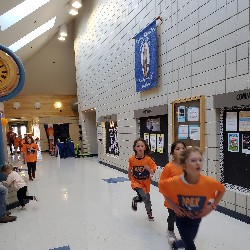 Students running at the Apex fun run