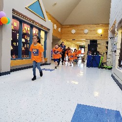 Students running at the Apex fun run