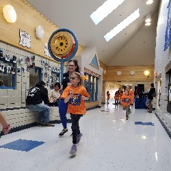 Students running at the Apex fun run