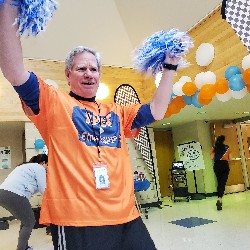 Mr. Doub cheering on the runners