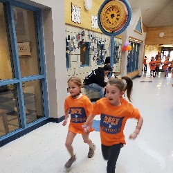 Students running at the Apex fun run