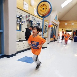 Students running at the Apex fun run